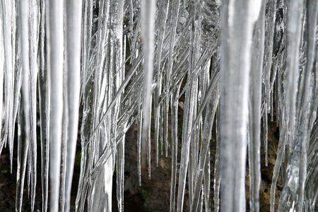 Snow frozen stalactites photo