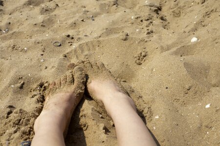 Sand beach barefoot tracks in the sand photo