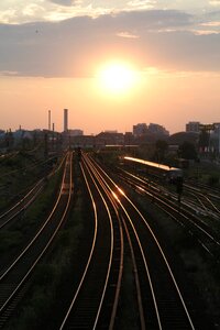 Railway line sunlight evening sky photo