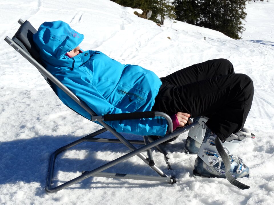 Ski jacket deck chair sunbathing