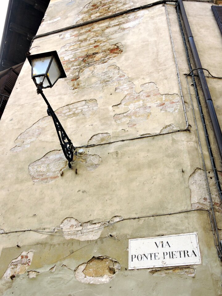 Cartel via stone bridge