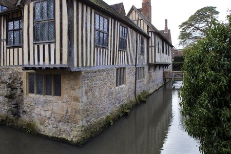 Stonework timber framing leaded lights