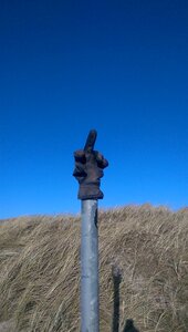 Road sign fun middle finger