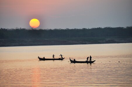 Fisherman sunset fishing at sunset