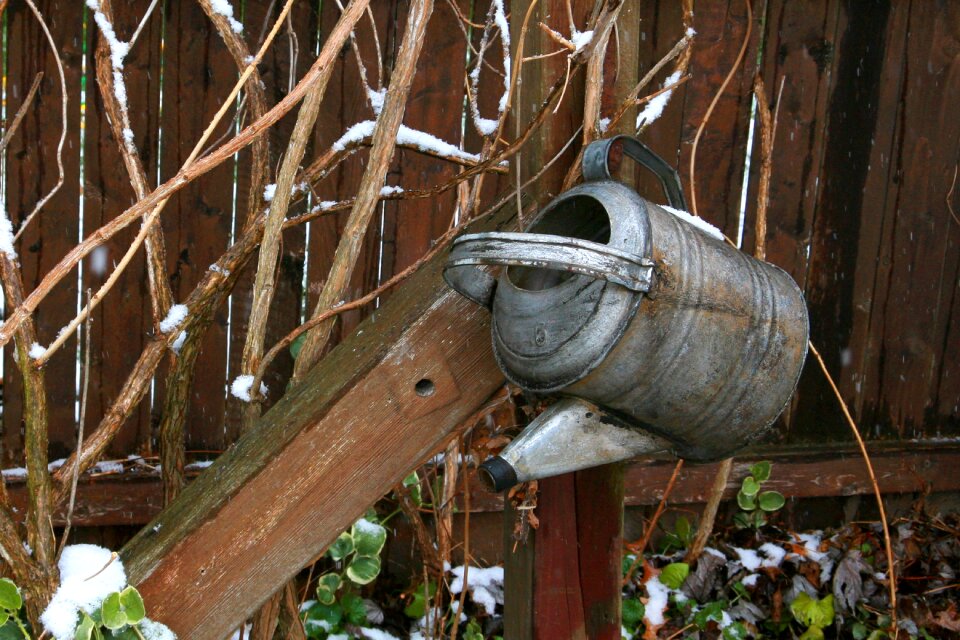 Watering can fence brown