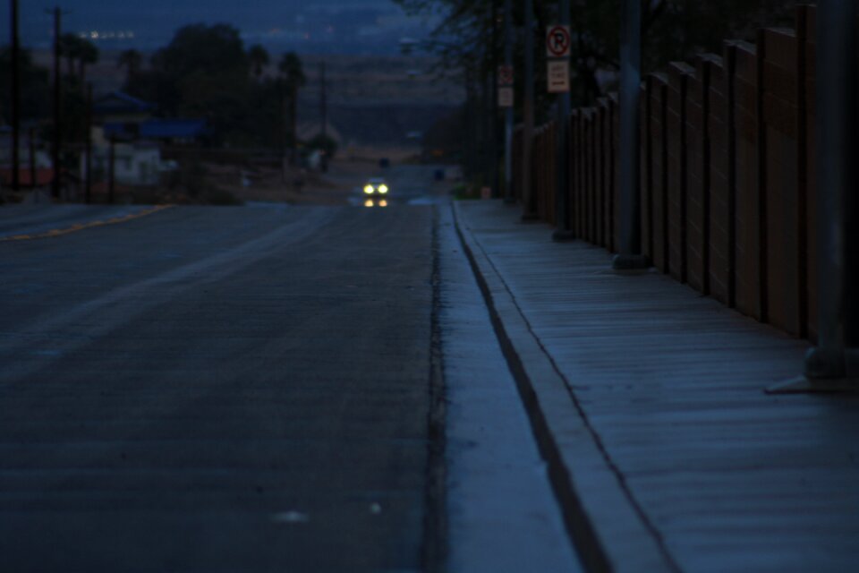 Eerie car lights blue lonely