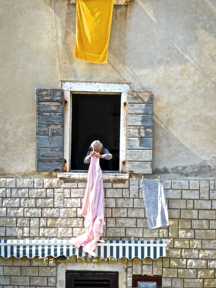 Woman drying clothesline