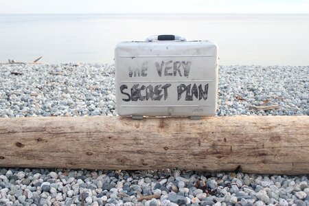Briefcase message log on beach