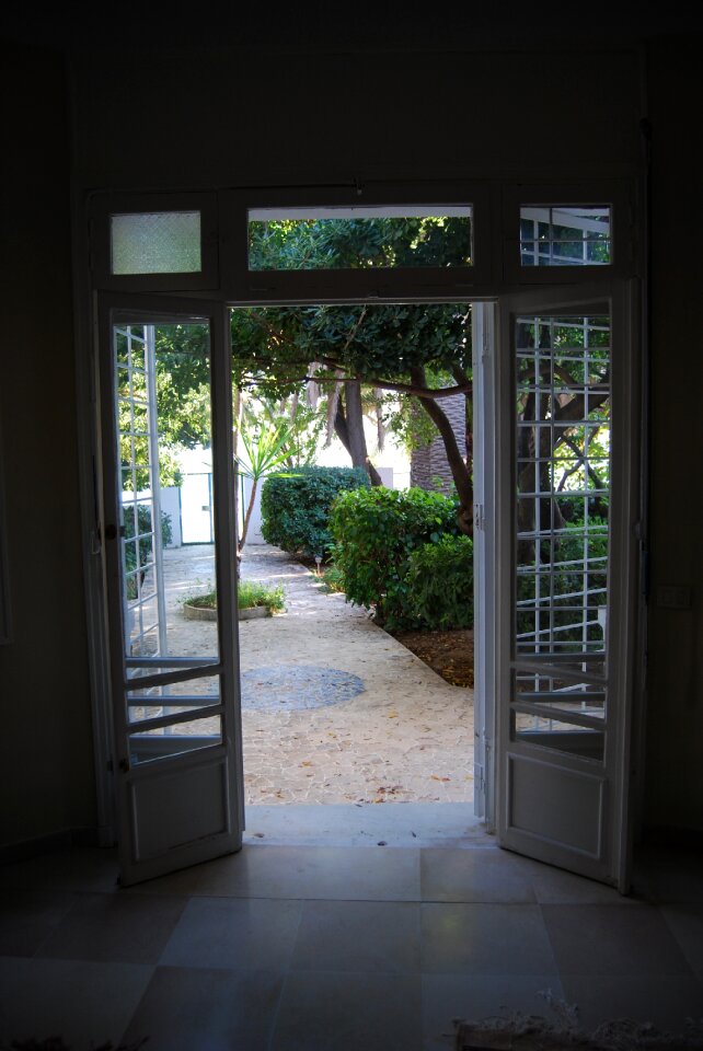 Door open garden against day