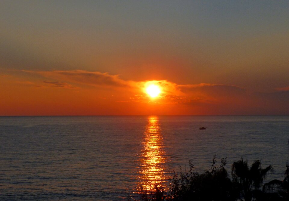 Sun and sea by the sea setting sun