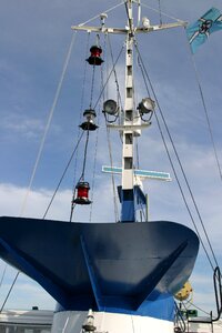 Ship mast spotlight clouds