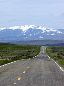 Straight road snow caped