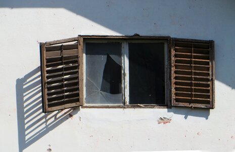 Destroyed shutter window pane photo