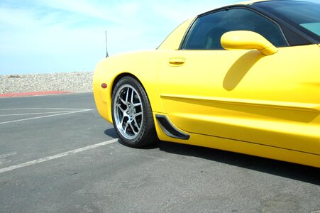 Yellow corvette ocean beach