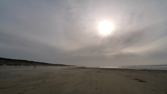 Sand coast sun photo