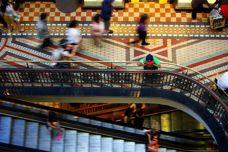 Retail shopper escalator photo