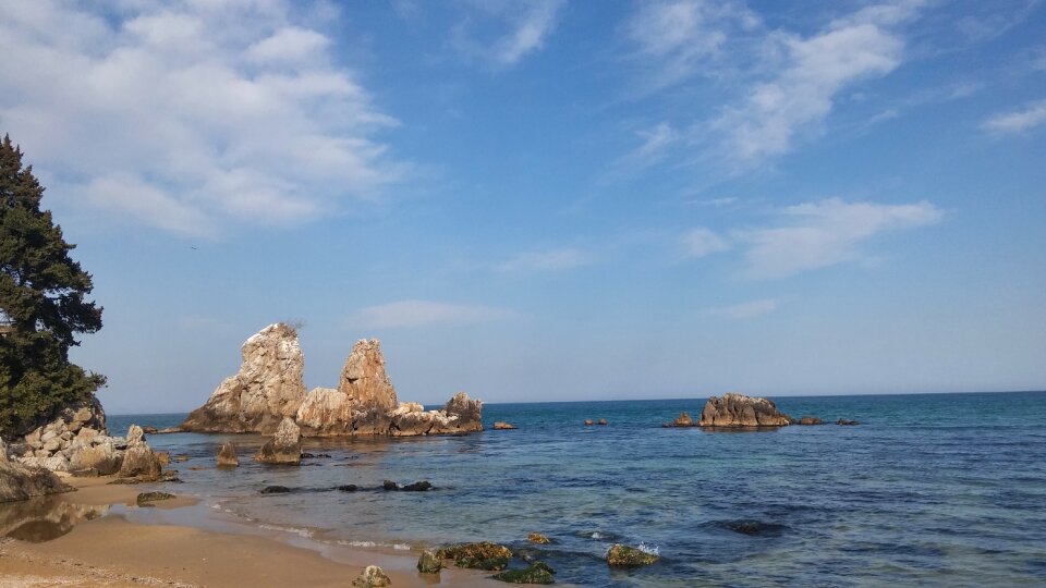 Sea rock blue sky photo