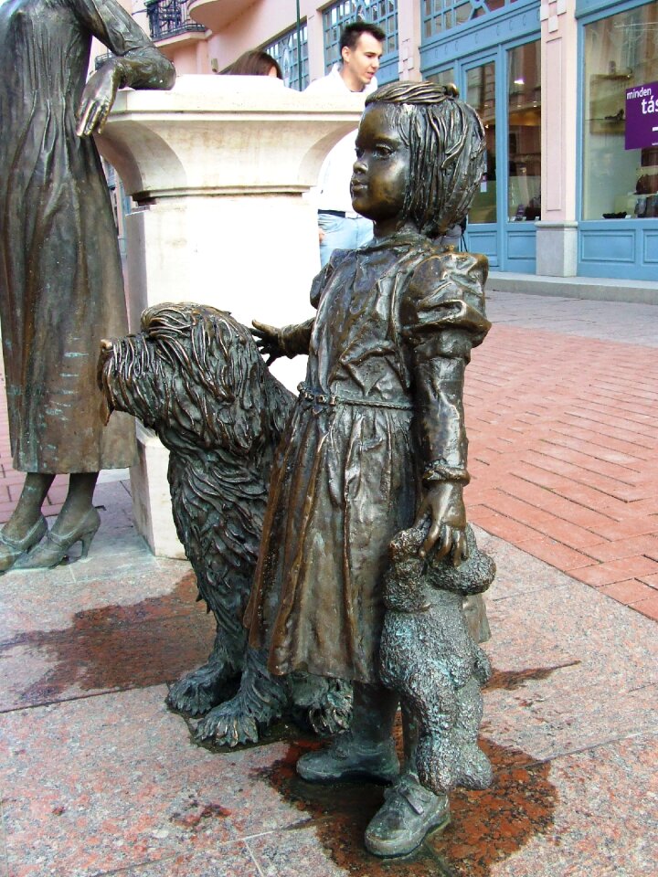 Statue girl with dog crucian street
