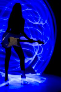 Woman neon blue guitar photo