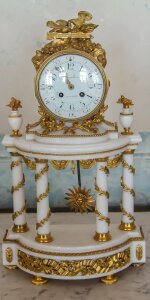Golden table clock painted