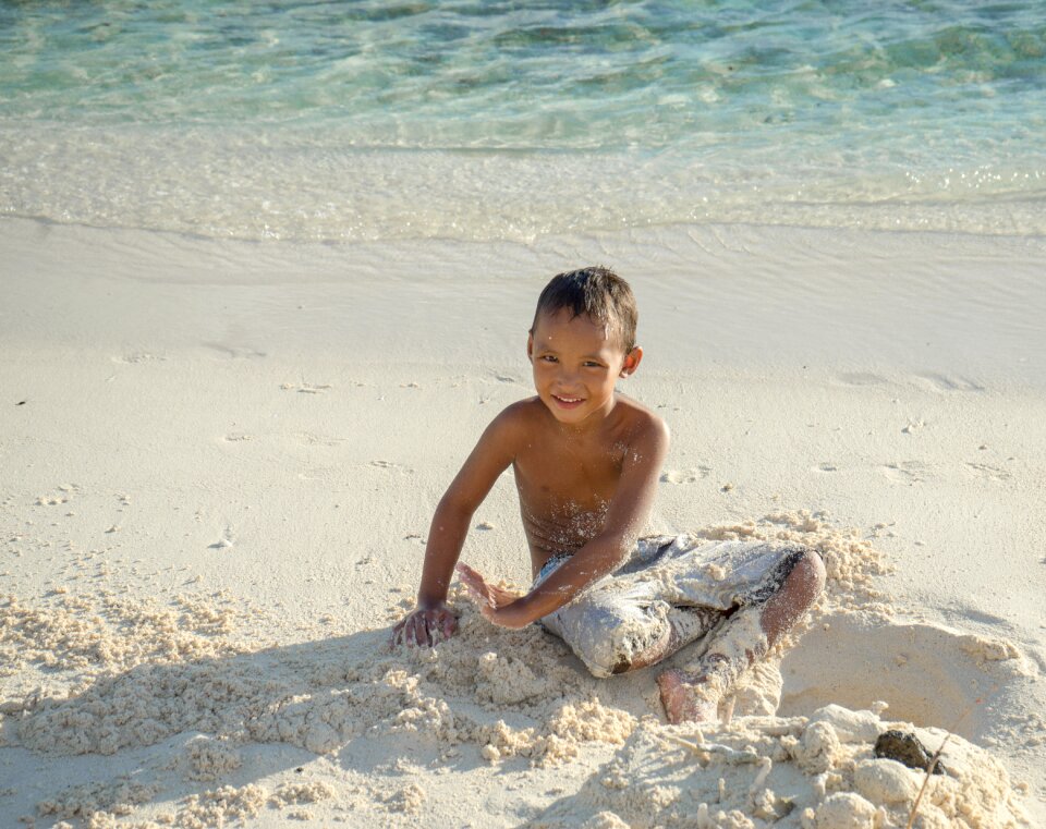 Child happy ocean