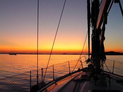 Sailing boat sunset marina photo