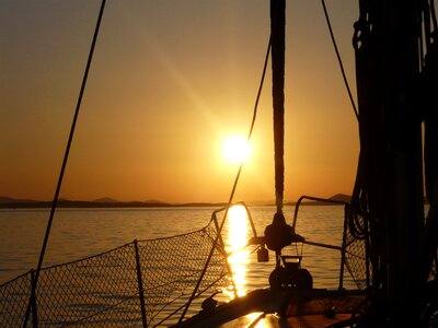 Sailing boat sunset marina photo