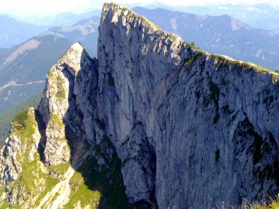 Sheep mountain steep rock wall panoramic view to the lake