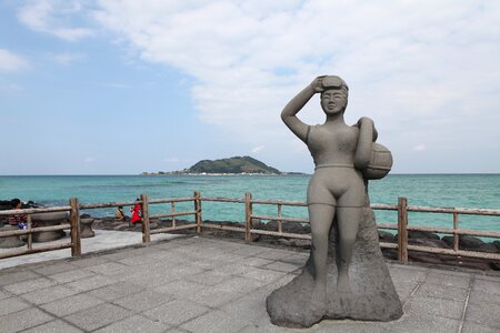 Stone statue jeju island beach jeju photo