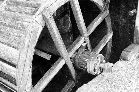 Worn black and white water mill photo