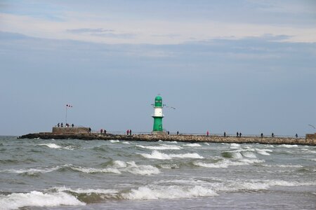 Sea lighthouse wave photo