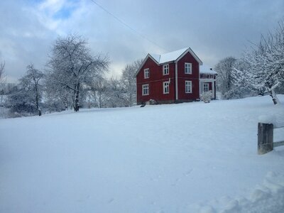 Red house snow twilight