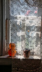 Curtain old house toy on the window