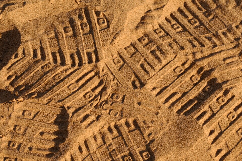 Traces tracks in the sand footprints photo