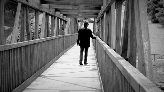 Man bridge black and white photo