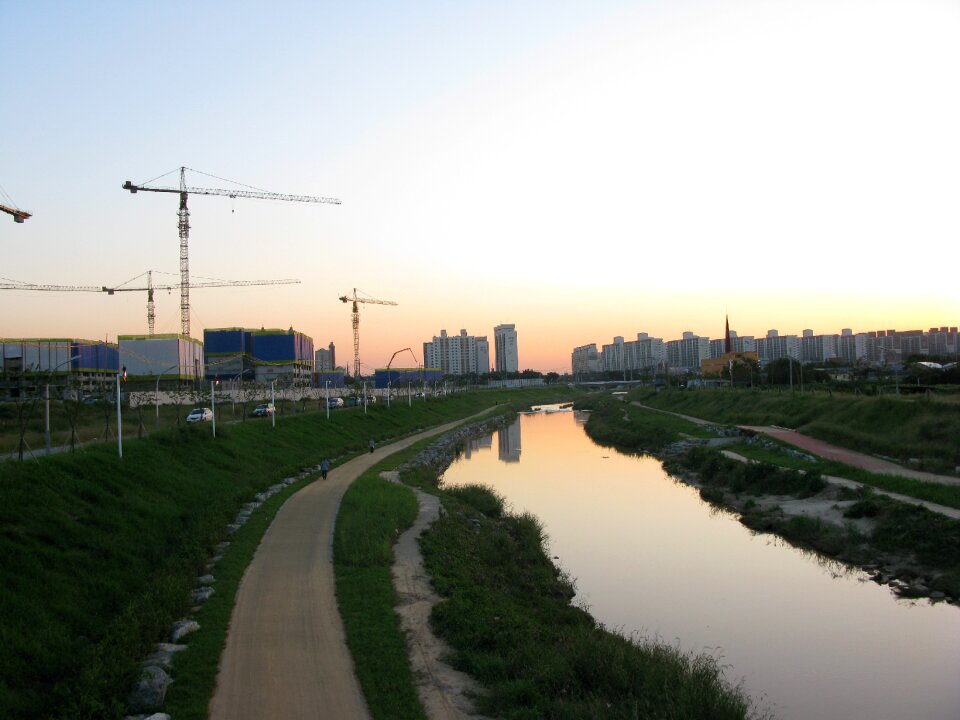 Sunset tower cranes tong bokcheon