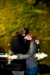 Kissing outside bottle photo