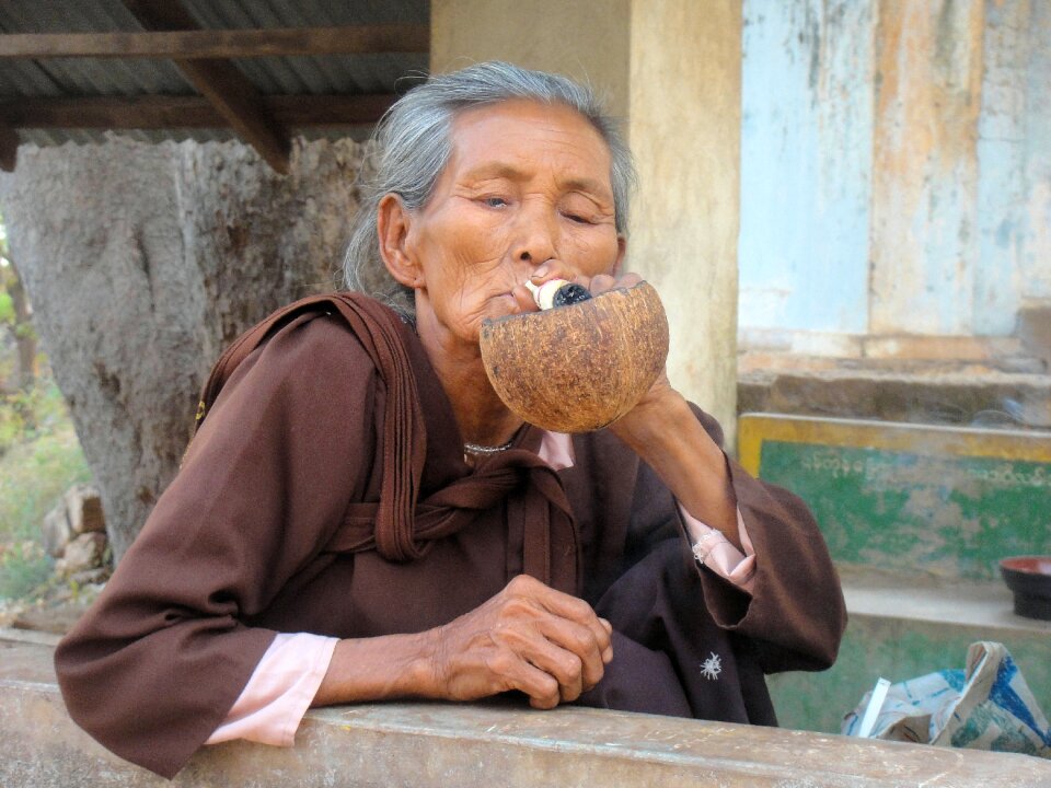 Burma old woman smoking