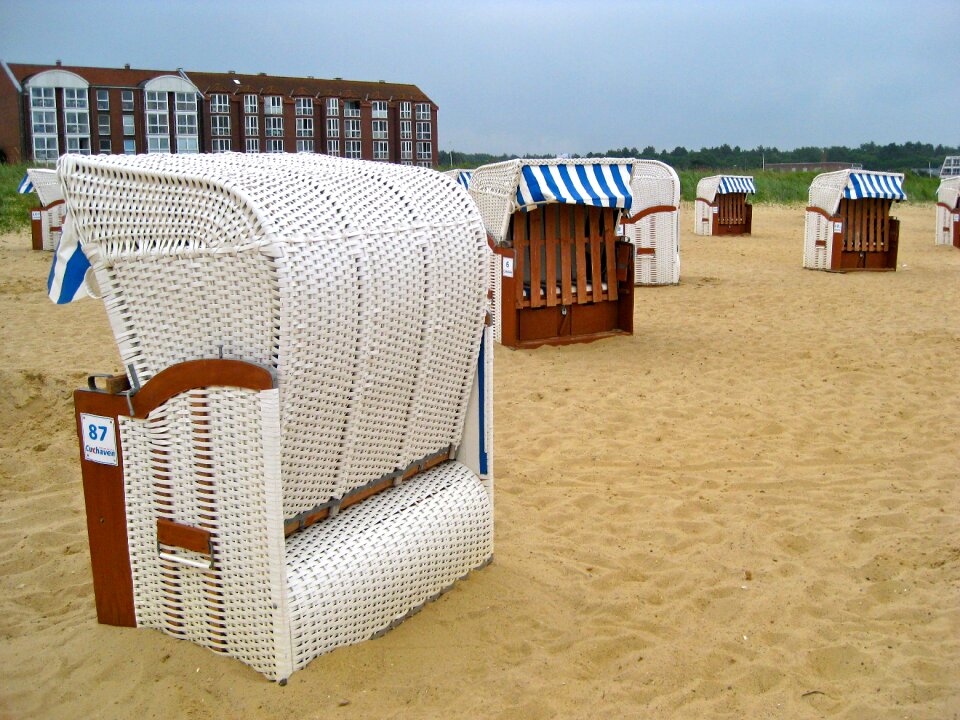 Beach chair clubs sand photo