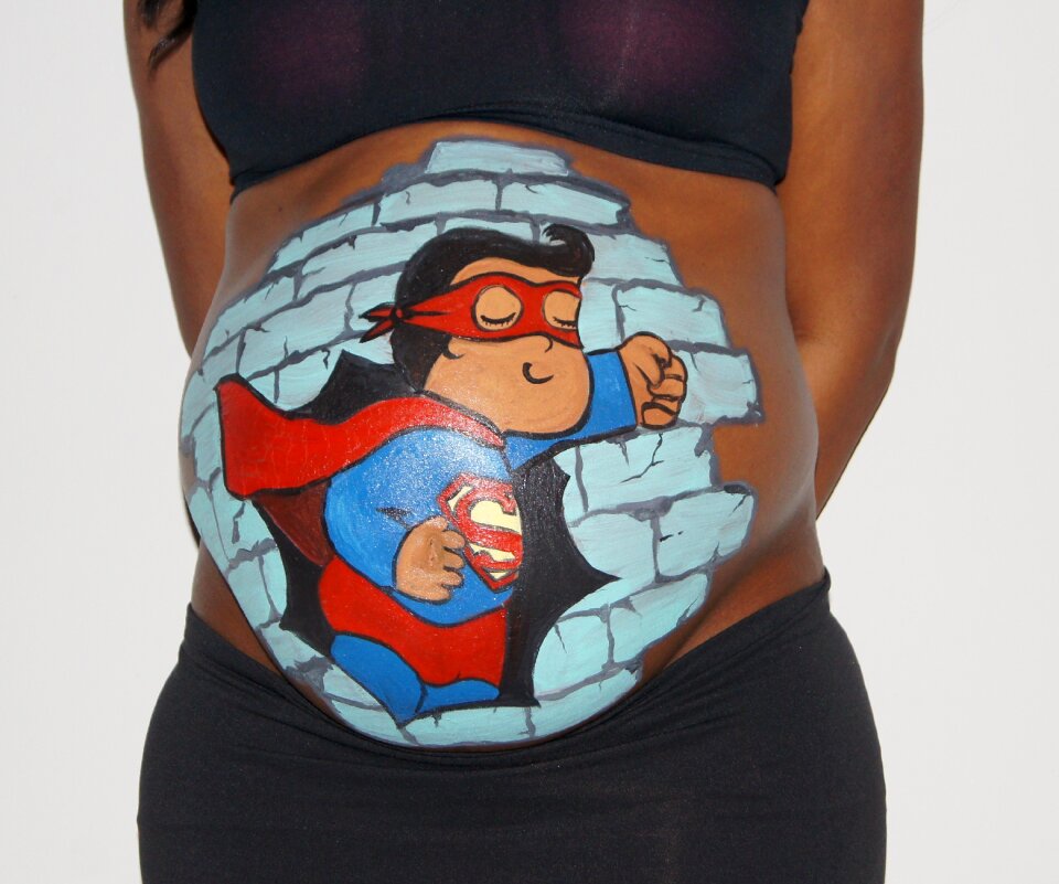 Belly painting pregnant baby