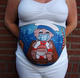 Belly painting baby sailor photo