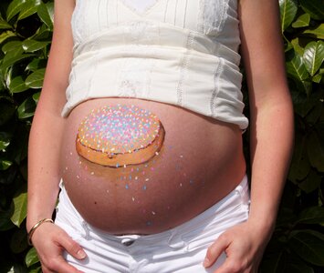 Belly painting pregnant baby