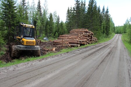 Log forest machine dirt road
