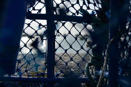 Net fisherman the conquet through the mesh photo