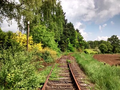 Railroad tracks neglected shut down photo