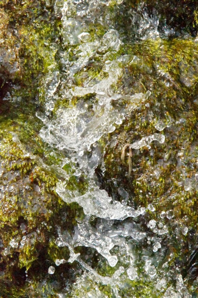 Drop of water air bubbles stone