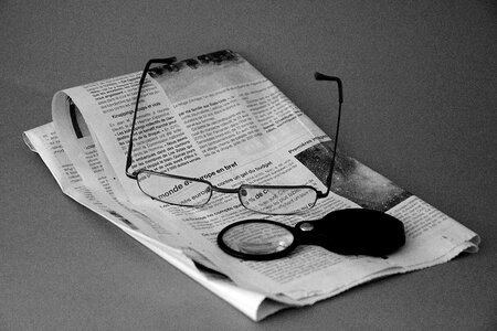 News reading magnifying glass photo