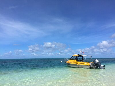 Blue sky and the sea yellow boat new caledonia