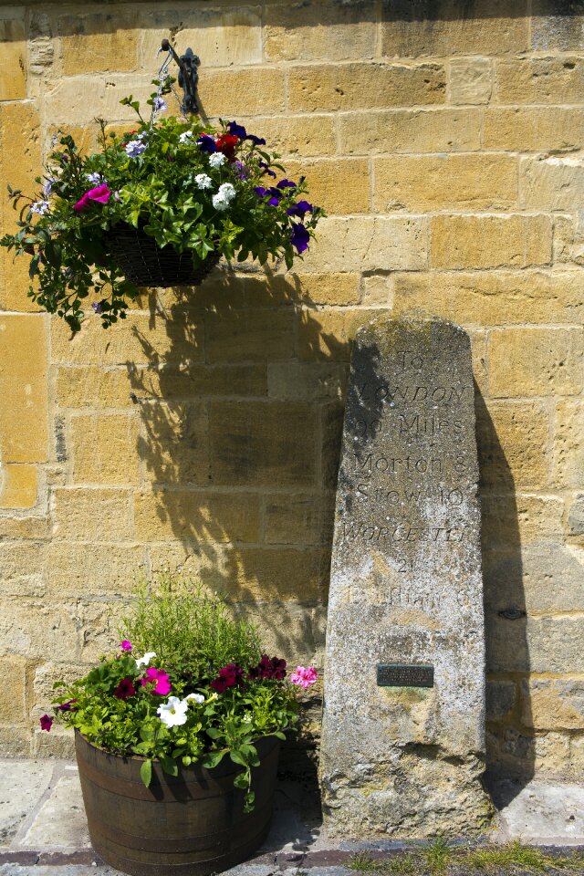Yellow stone wall hanging basket planter tub