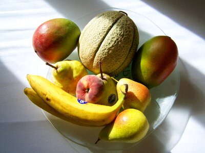 Mixed fruit bowl light shadow delicious fruits photo